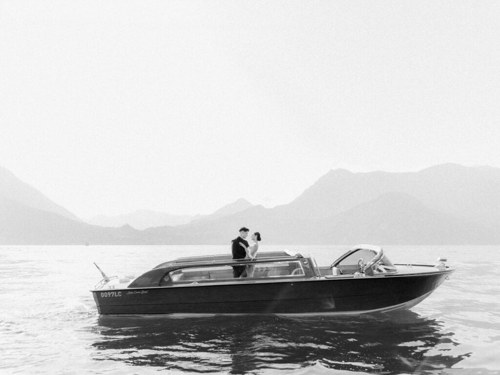 a couple on a boat on lake Como