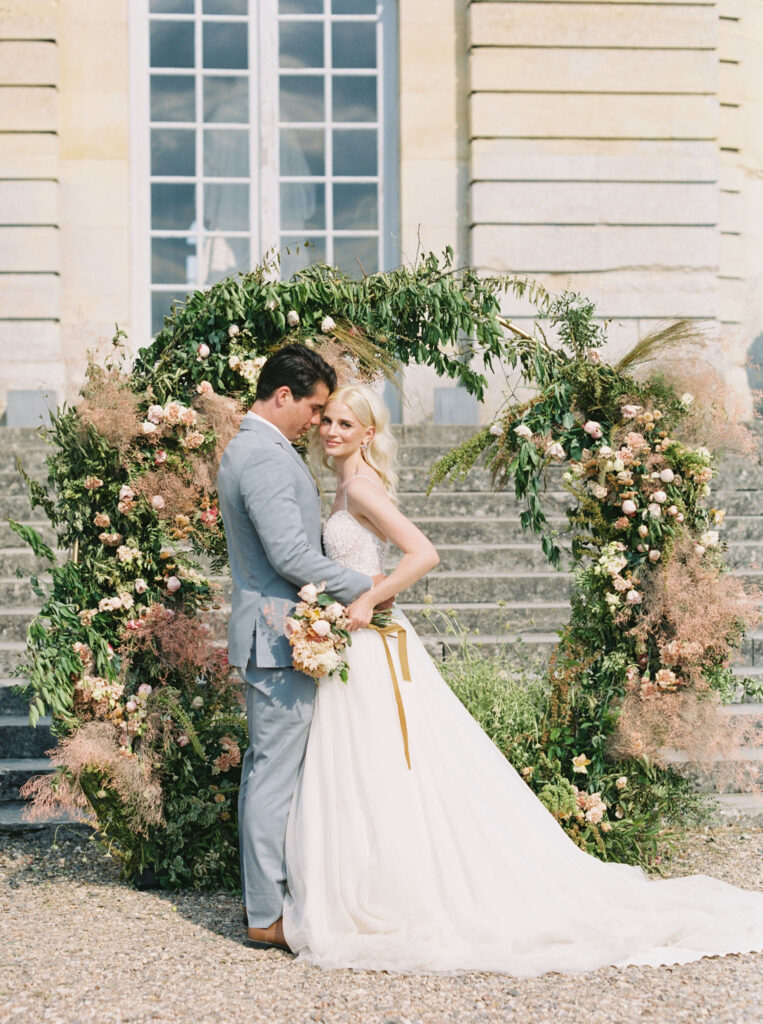 bride & groom at wedding in Chateau De Champlatreux 