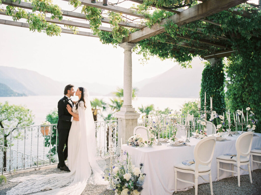 bride and groom with a beautiful set up overlooking lake Como