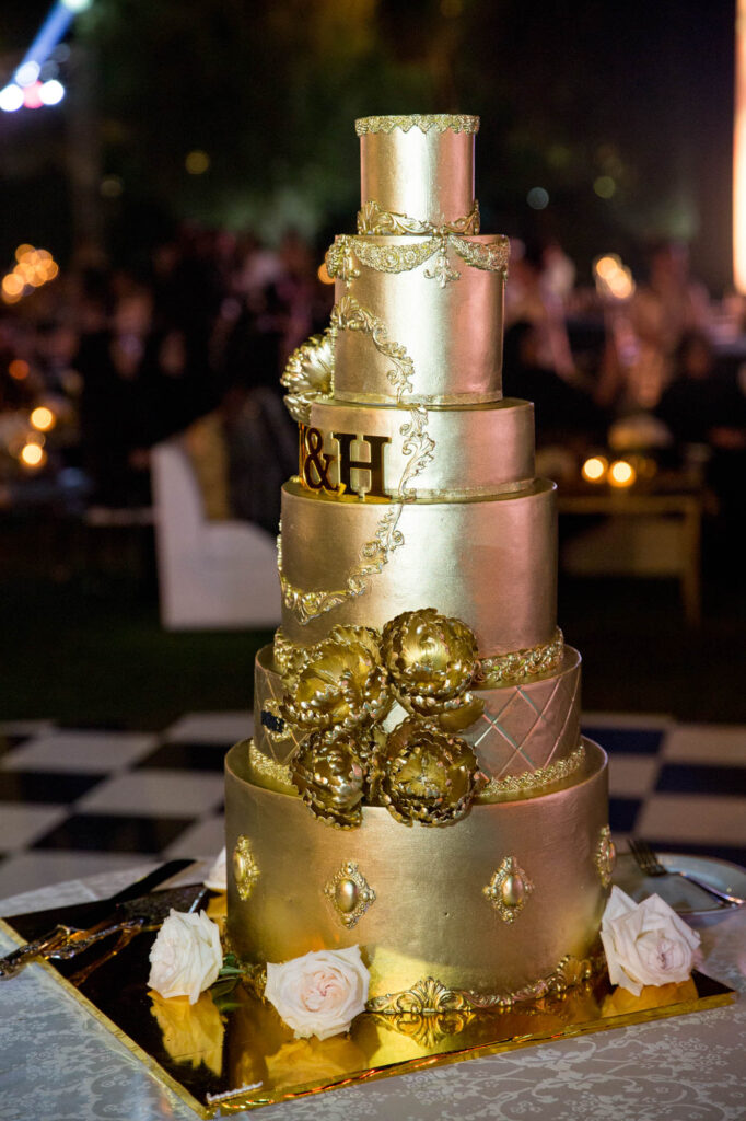 golden cake at Outdoor Wedding at Melia Desert Palm